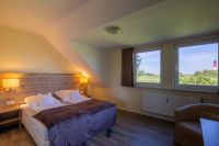 MeerLand Pellworm - Zimmer mit Ausblick auf Leuchtturm
