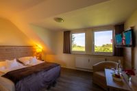 MeerLand Pellworm - Zimmer mit Ausblick auf Leuchtturm
